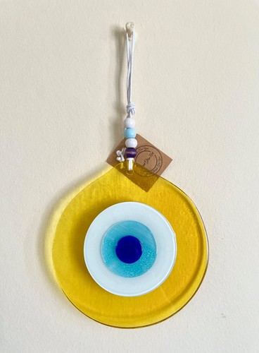 Yellow evil eye - evil, fused