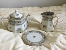 Three piece china teapot, hot