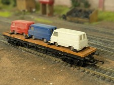 TRIANG HORNBY R.563 BOGIE BOLSTER WAGON WITH 3 FORD THAMES VANS 