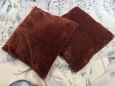 A Pair of Brown Cushions for