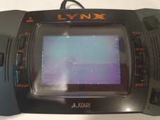 Atari Lynx 2 console working with official  AC adapter and Paperboy game card