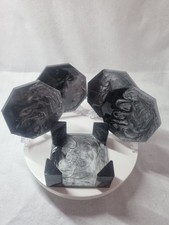 Black and silver coasters and