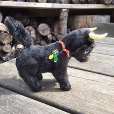 Old Vintage Retro Synthetic Fur Covered Wing Up Bull Tin Toy - Tail Spins Round