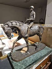 A Bronze Statue Of A Jockey