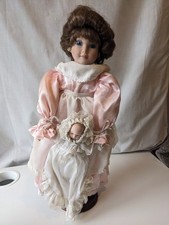 Alberon Dolls Limited  Porcelain Doll holding a smaller baby doll
