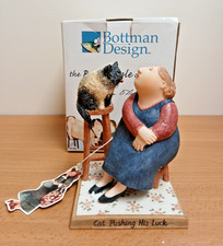 Cat Pushing His Luck Figurine