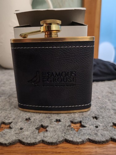 The famous grouse scotch - the,
