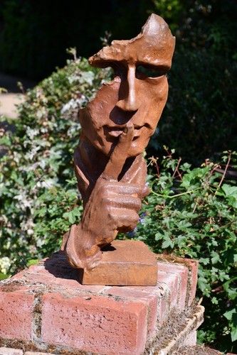 Large rusty cast iron face - iron,