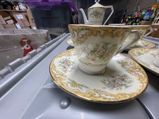 6 cups and saucers, coffee pot