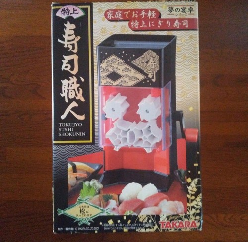 Sushi rice ball maker making