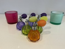 A Selection Of Empty Mini Coloured Glass Bottles Purple Green & Orange