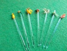 7 small glass cocktail sticks with animal design