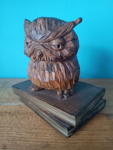 Wooden carving grumpy owl - of,