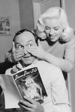 Diana Dors clowns with man