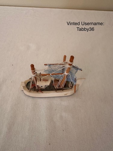 Small wooden boat ornament