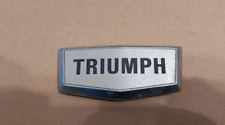 TRIUMPH  BADGE  IN GOOD CONDITION .