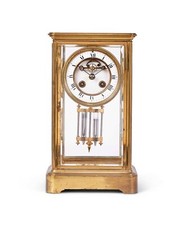 A LATE 19TH CENTURY FRENCH GILT BRASS FOUR GLASS MANTEL CLOCK BY S. MARTI & CIE