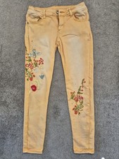 Golden skinny trousers with