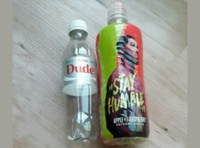 Empty Lucozade Anthony Joshua & Diet Coke Dude Bottles.