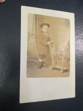 Postcard of child with push along toy horse (Posted 1905 Dorking to W Hampstead)