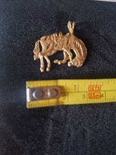  14k Gold Saddled Bucking