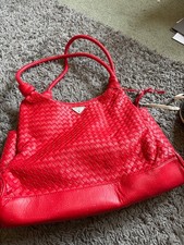 Red prada leather bag signs of