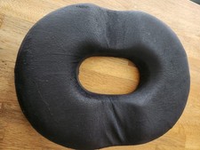 Pair of unbranded donut seat cushions in grey and black