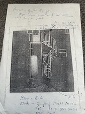 Antique metal spiral staircase with landing