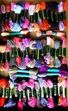JOB LOT OF 50 SKEINS OF ANCHOR & DMC TAPESTRY WOOL IN REDS & MAUVES