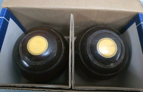 Pair brown lawn bowls - a,