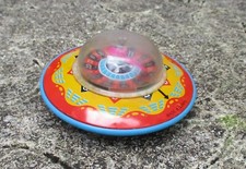Vintage Tinplate UFO Flying Saucer on Wheels Roulette Wheel Toy. Made in Japan