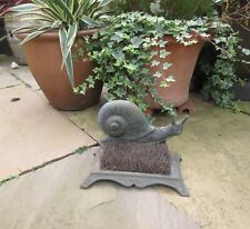 Vintage style reproduction weathered cast metal snail boot shoe scraper brush