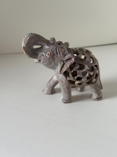 Hand carved soapstone - hand, elephant