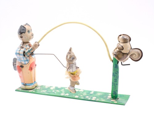 Vintage tin plate dog and - tin,