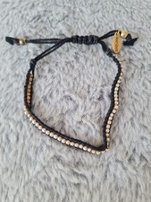 Hult Quist Gold Tone White