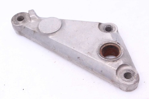 Footrest retaining plate rear