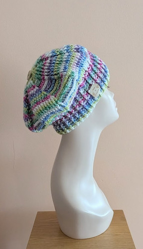 Hand crocheted beret rainbow - hand,