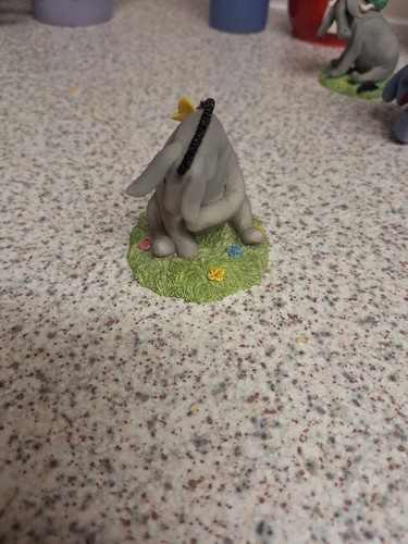 Disney eeyore figurine sitting - eeyore,