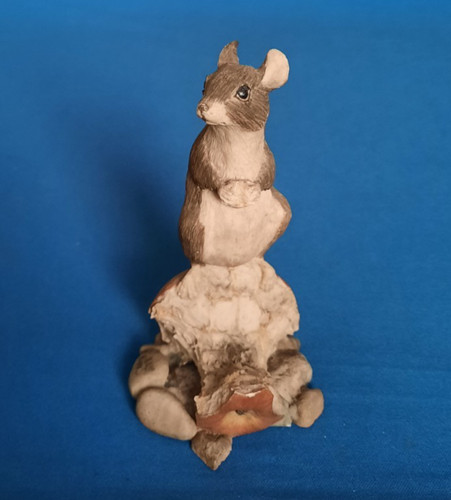 Figurine mouse feeding on - of,