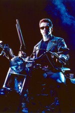 Arnold Schwarzenegger sitting