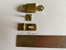 A  BRASS STAPLE AND HASP WITH A BRASS YALE PADLOCK AND KEY DISPLAY CABINET, CASE