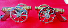 TWO MINITURE CANNONS CAST IRON WITH DECORATIVE BRASS BARREL APPROX - 40MM LONG