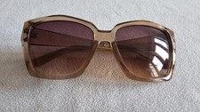 Foster Grant brown frame sunglasses.