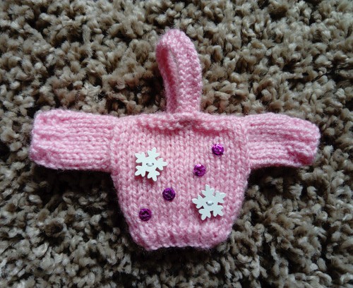 Hand knitted mini pink xmas - hand,