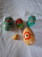 4 Wooden Hand Painted Eggs With A Little Wooden Duck Living Inside