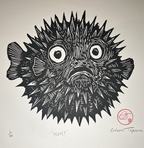 Hand carved pufferfish - hand,