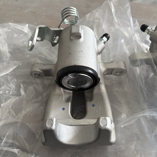 New rear brake calipers left - new,