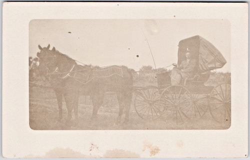 C1909 man driving horse buggy - driving,