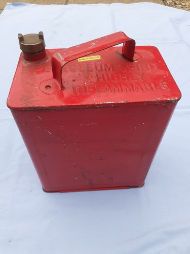 Old red petrol can motoring - red,