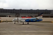 PHOTO  REX SAAB 340B VH-EKX WITH SHARK CAGE DIVING PRMOTIONAL VINYLS AT MELBOURN